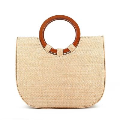 Vrouwentas met gras en houten handvat voor ontspanning met modedesigns